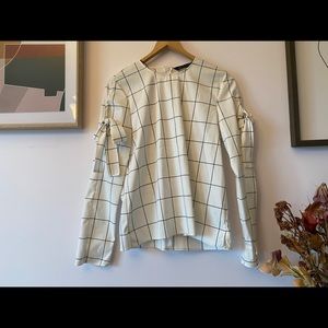 White top with stripes